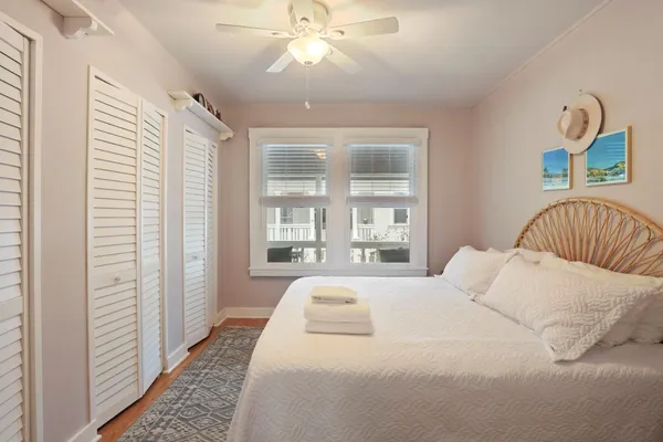 a kitchen with stainless steel appliances granite countertop a stove a sink dishwasher and a refrigerator with wooden floor