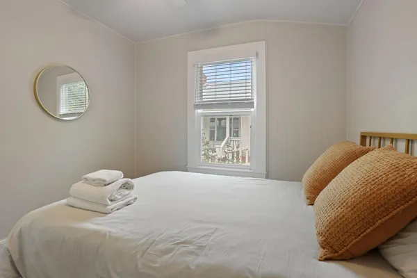 a kitchen with stainless steel appliances granite countertop a sink cabinets a stove and a window