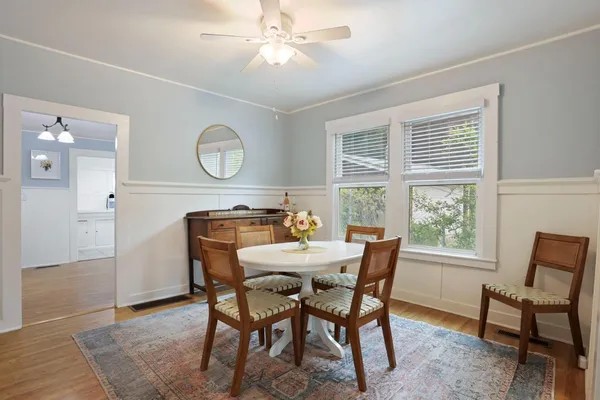 a dining room with furniture and window