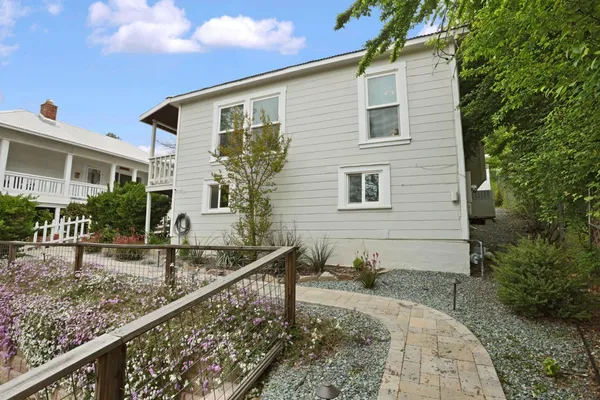 a view of outdoor space with green field and trees all around