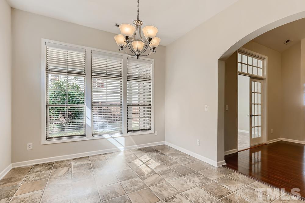 7809 Berry Crest Avenue Raleigh, NC 27617 - Photo 13 of 27 a view of an empty room with a window