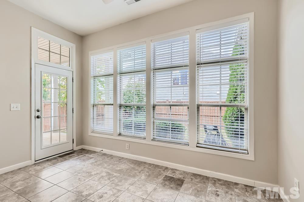 7809 Berry Crest Avenue Raleigh, NC 27617 - Photo 23 of 27 a view of an empty room with a window