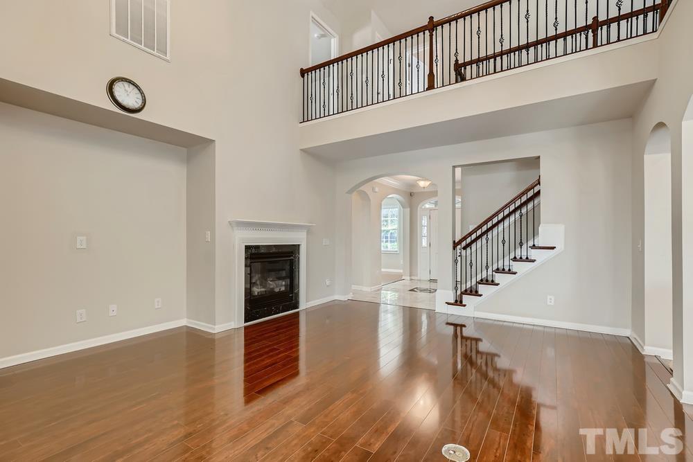 7809 Berry Crest Avenue Raleigh, NC 27617 - Photo 4 of 27 a view of entryway and hall with wooden floor