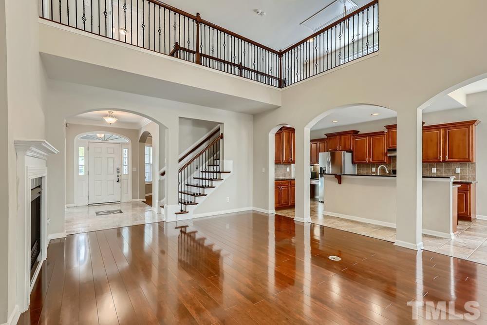 7809 Berry Crest Avenue Raleigh, NC 27617 - Photo 5 of 27 a view of entryway and hall with wooden floor
