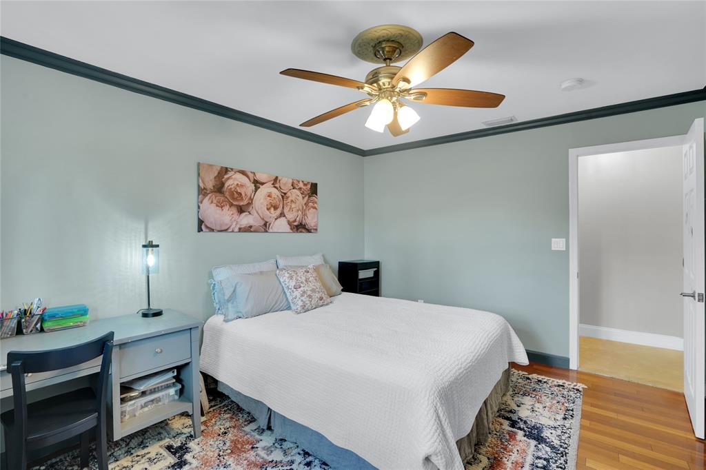 Southwest Ranches Southwest Ranches, FL 33331 - Photo 31 of 50 a bedroom with a bed and a chandelier