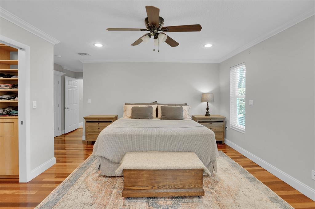 Southwest Ranches Southwest Ranches, FL 33331 - Photo 35 of 50 a bedroom with a bed and a chandelier