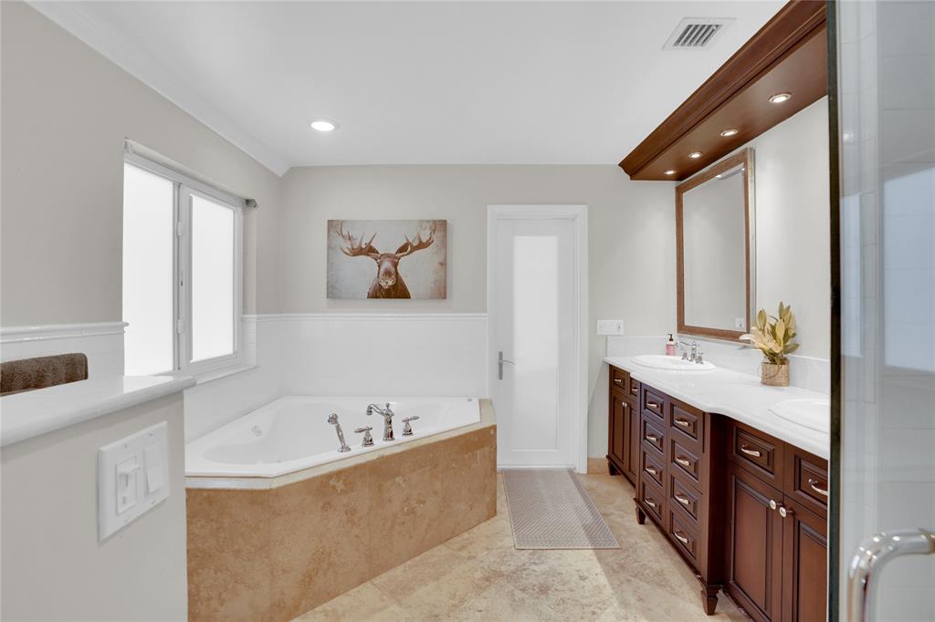 Southwest Ranches Southwest Ranches, FL 33331 - Photo 36 of 50 a bathroom with a bathtub and a sink