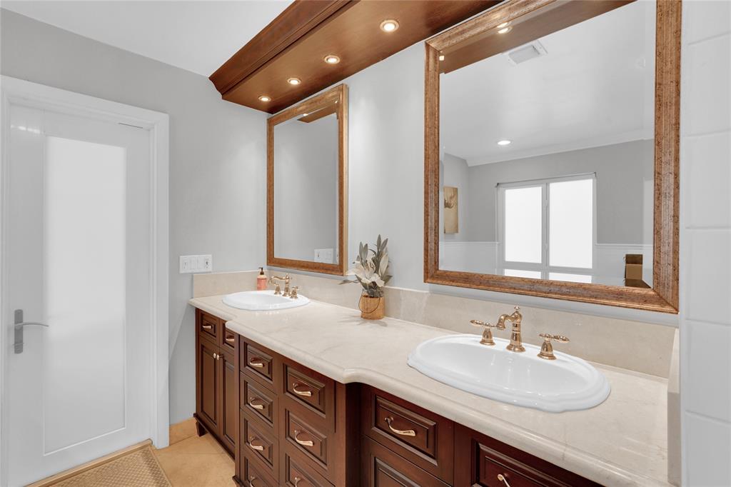 Southwest Ranches Southwest Ranches, FL 33331 - Photo 38 of 50 a bathroom with a double vanity sink and a mirror
