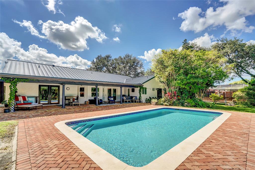 Southwest Ranches Southwest Ranches, FL 33331 - Photo 44 of 50 a front view of a house with a yard