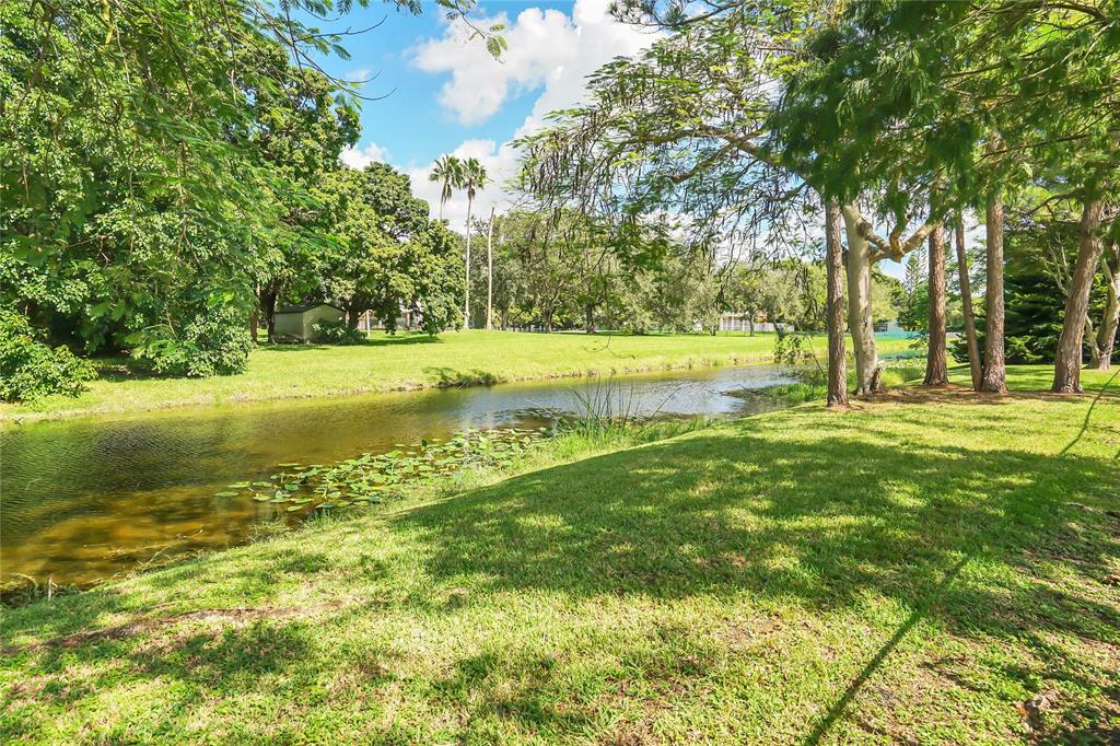 Southwest Ranches Southwest Ranches, FL 33331 - Photo 48 of 50 a swimming pool with an outdoor space and seating area