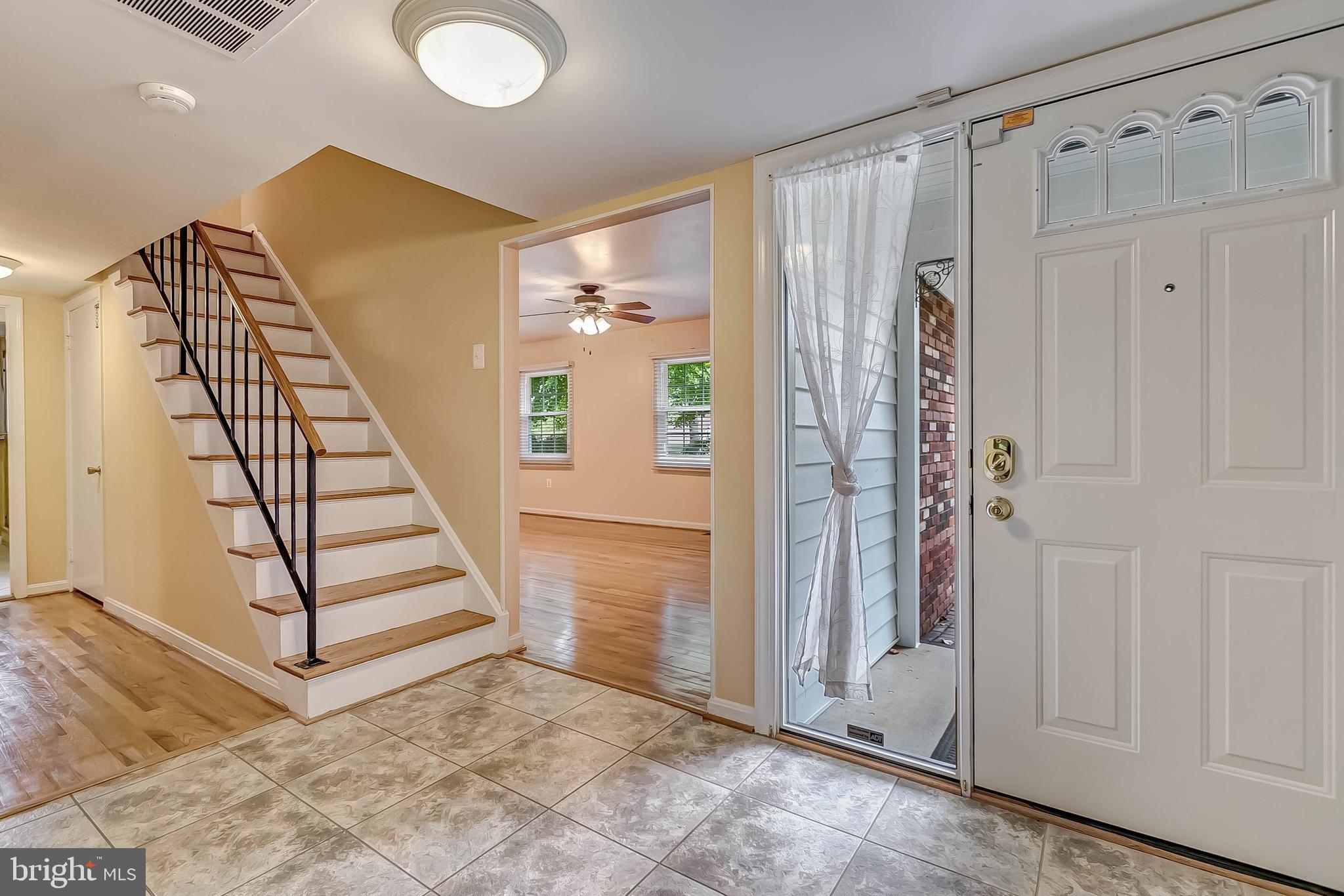 2908 Bluff Point Lane Silver Spring, MD 20906 - Photo 32 of 63 Entrance foyer with wood staircase