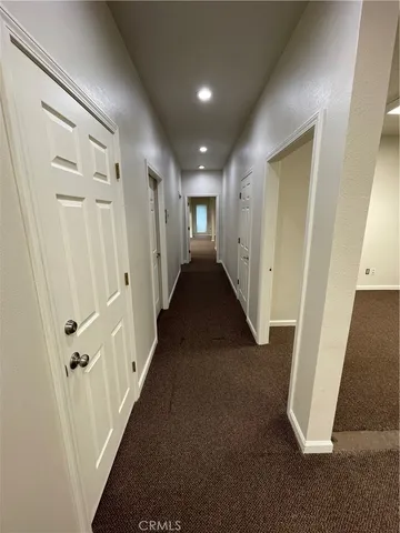 a room with wooden floor and furniture