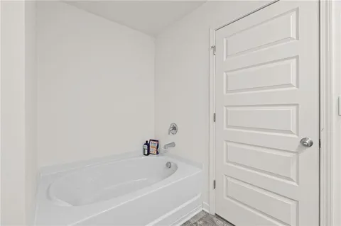 a bathroom with double sink and a mirror