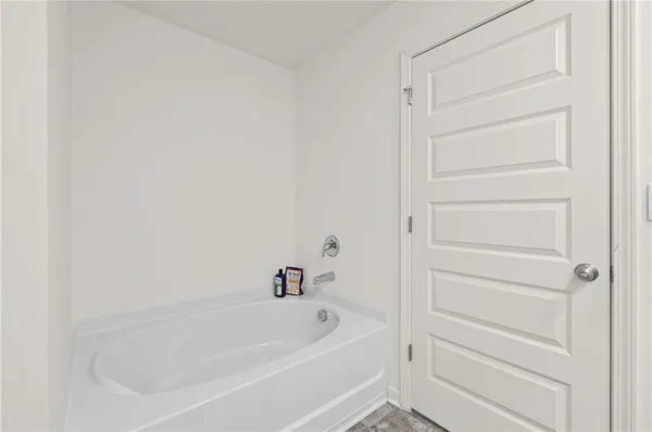 a bathroom with double sink and a mirror