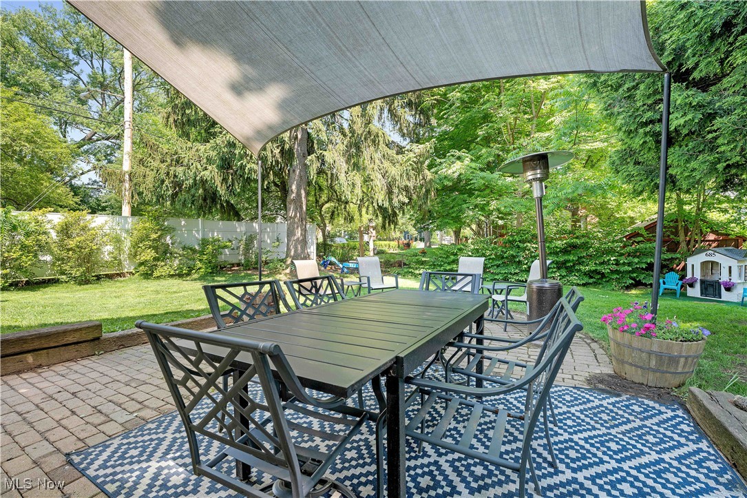 685 Ecton Road Akron, OH 44303 - Photo 32 of 34 View of patio with outdoor dining area and view of wooded area