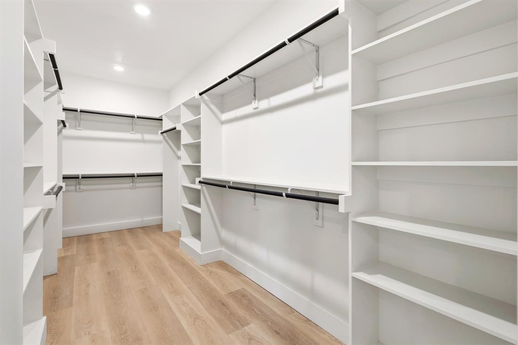 413 North Patton Avenue Dallas, TX 75203 - Photo 13 of 21 a view of walk in closet with empty racks