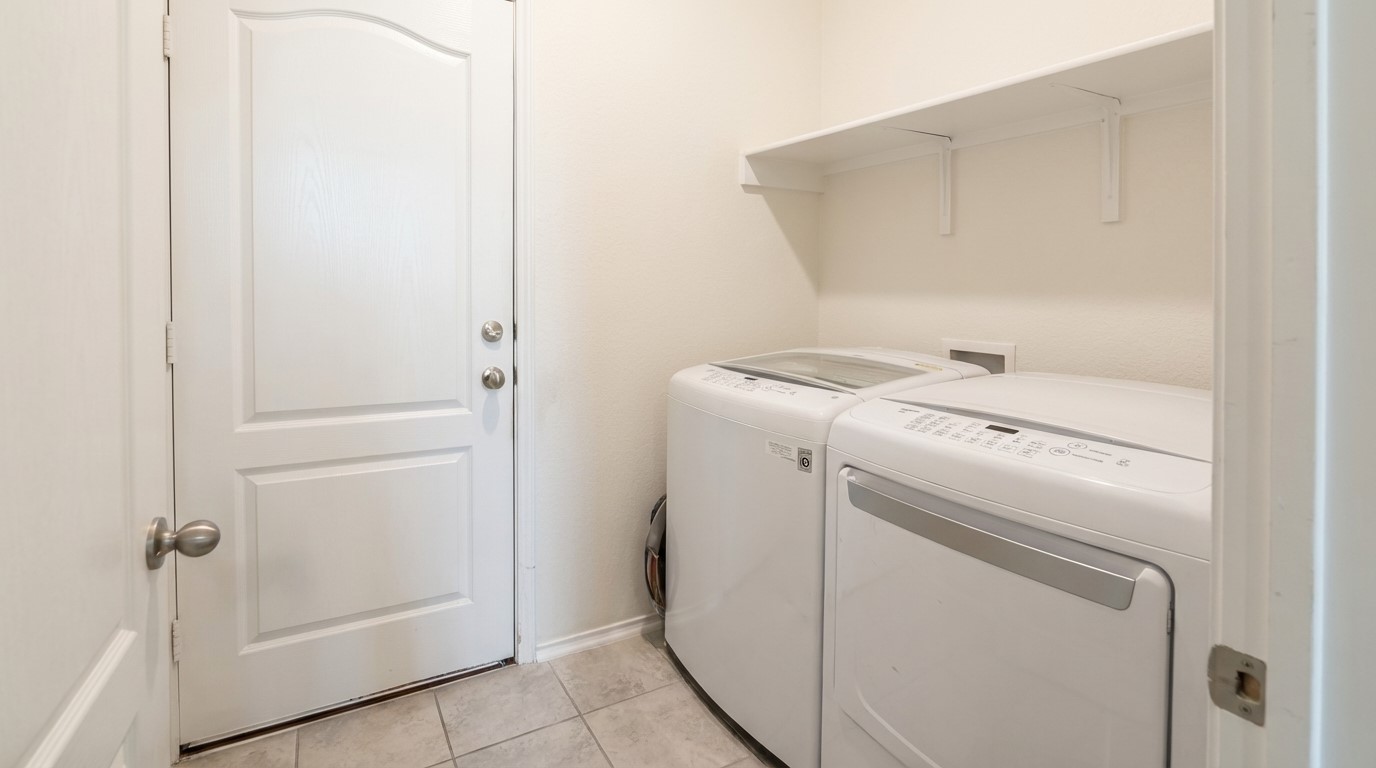 308 Los Cobos Lane Georgetown, TX 78626 - Photo 14 of 31 a utility room with dryer and washer