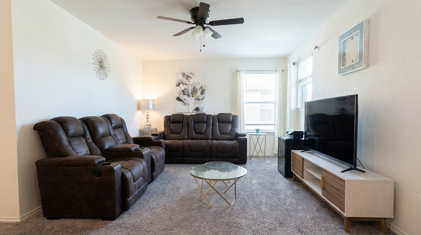 308 Los Cobos Lane Georgetown, TX 78626 - Photo 23 of 31 a living room with furniture and a flat screen tv