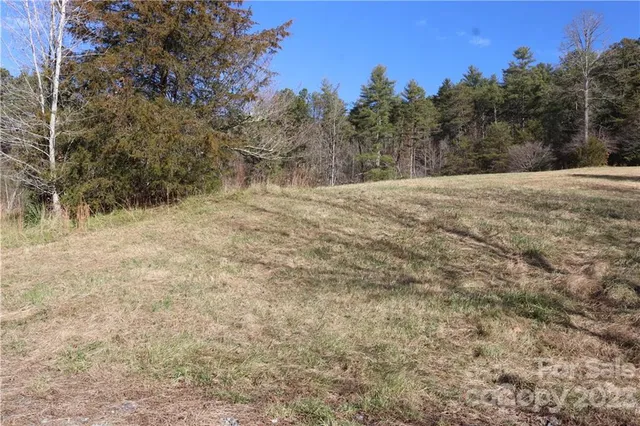 a view of dirt yard and mountain view