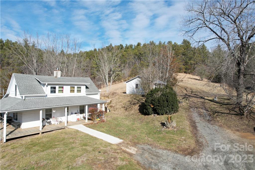 36 Stockton Road Weaverville, NC 28787 - Photo 28 of 31 a view of a white house with a yard and sitting area