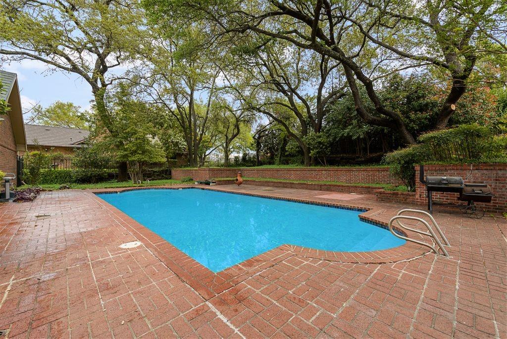 2 Eastshore Road Heath, TX 75032 - Photo 27 of 30 a view of a swimming pool with an outdoor space and seating area
