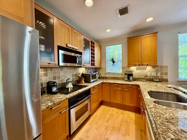 a kitchen with a sink a stove and refrigerator
