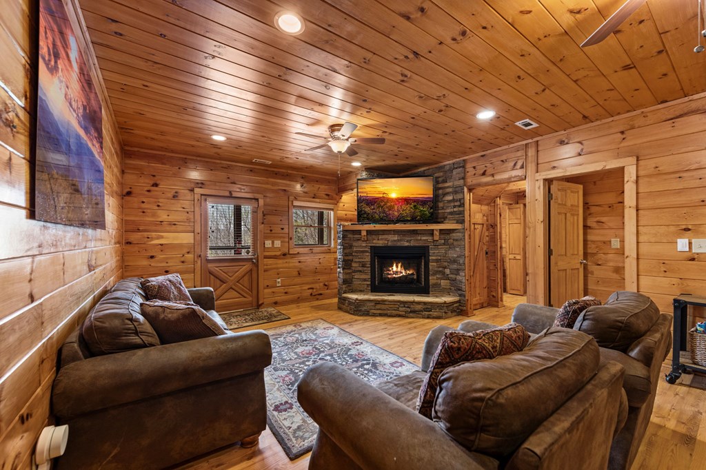 890 Brittney Drive Blue Ridge, GA 30513 - Photo 29 of 37 a living room with furniture and a fireplace