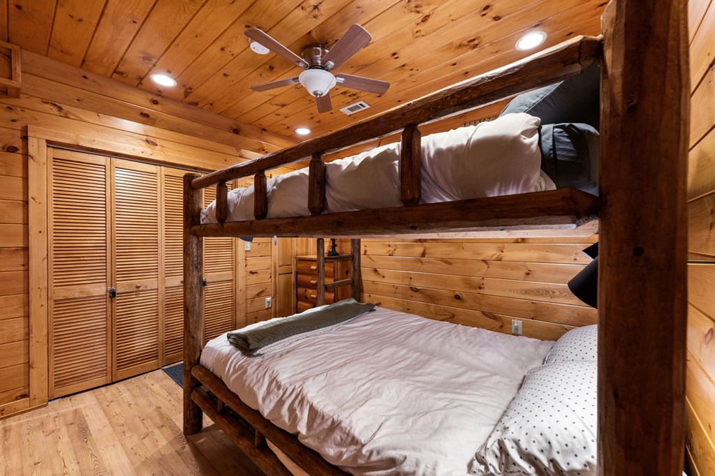 890 Brittney Drive Blue Ridge, GA 30513 - Photo 31 of 37 a bedroom with a bed and wooden floor