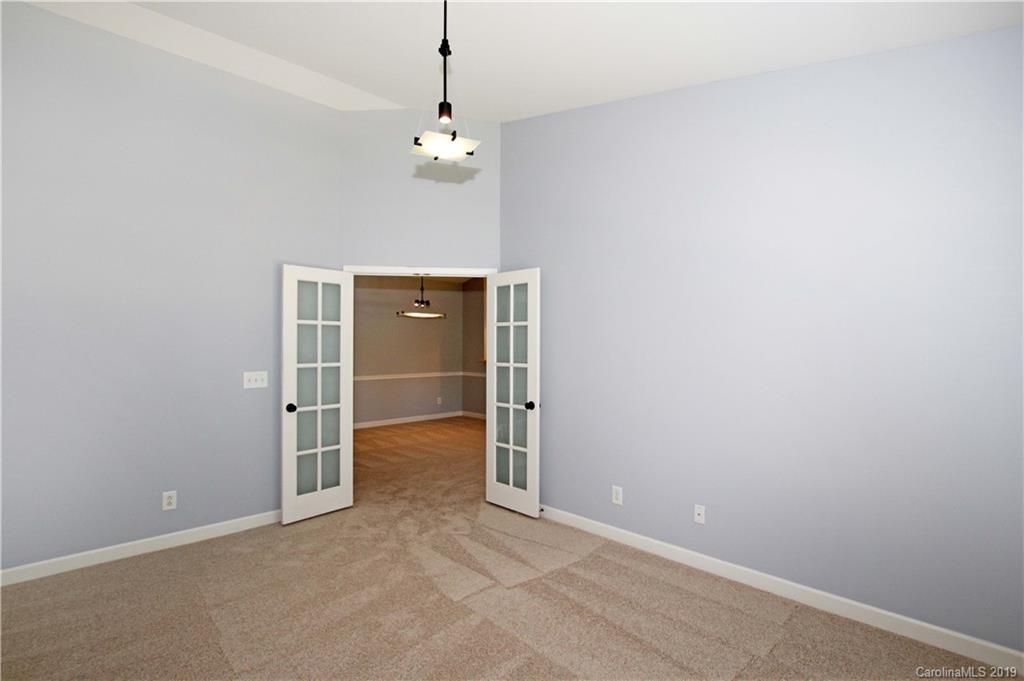 16646 Amberside Road East Cornelius, NC 28031 - Photo 18 of 29 an empty room with chandelier fan