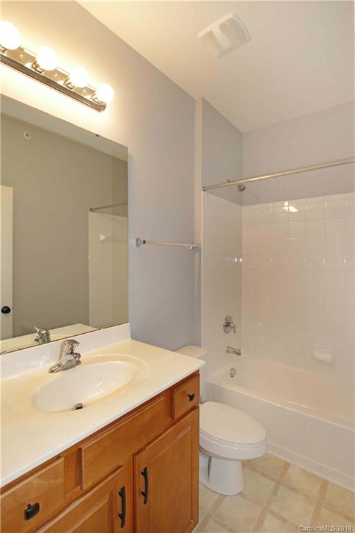 16646 Amberside Road East Cornelius, NC 28031 - Photo 20 of 29 a bathroom with a bathtub shower sink vanity mirror and toilet
