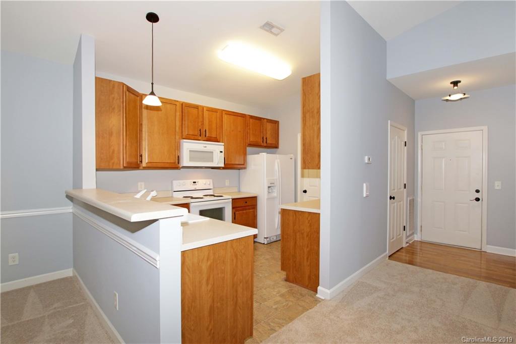 16646 Amberside Road East Cornelius, NC 28031 - Photo 6 of 29 a view of a kitchen with wooden floor