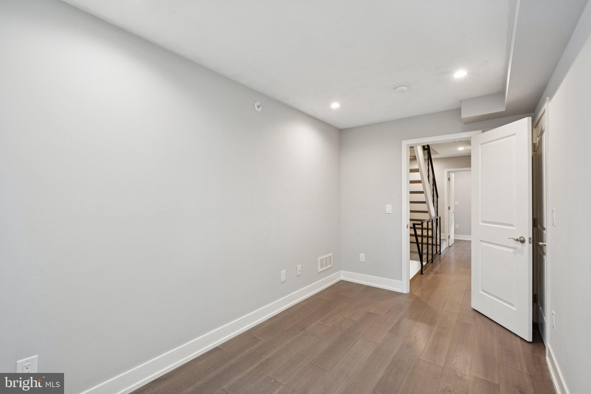 1533 South Lambert Street Philadelphia, PA 19146 - Photo 17 of 29 a view of an empty room with wooden floor and closet