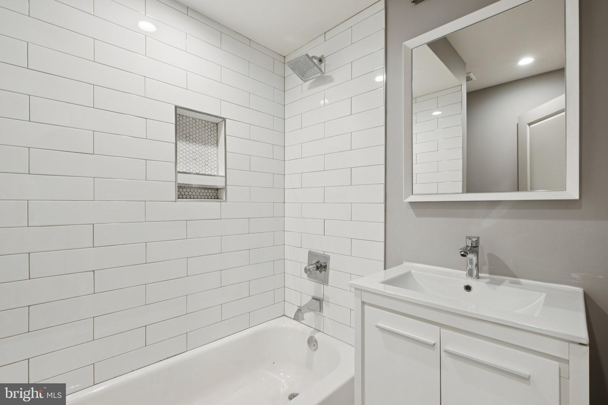1533 South Lambert Street Philadelphia, PA 19146 - Photo 18 of 29 a bathroom with a sink a toilet and shower