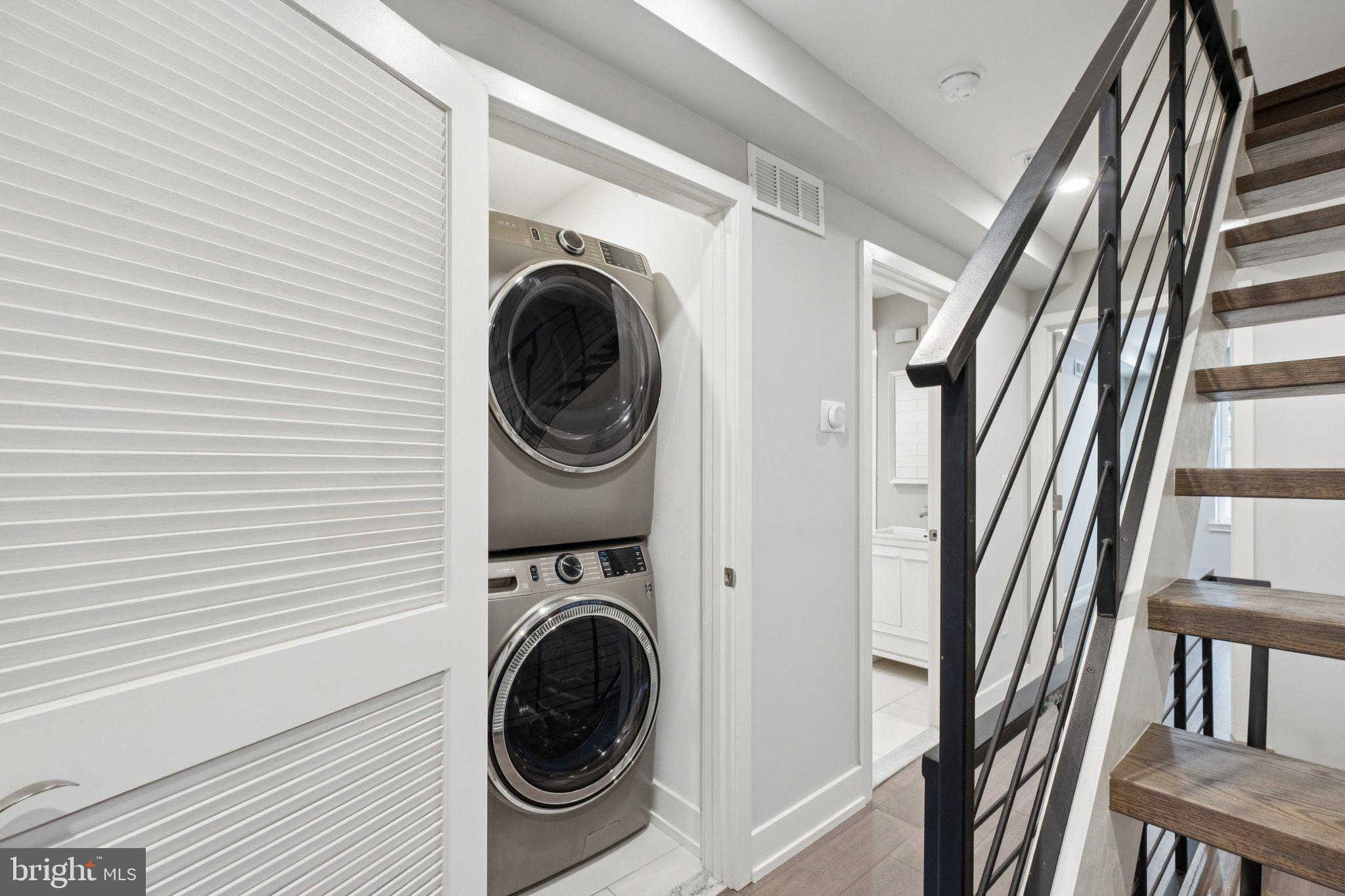 1533 South Lambert Street Philadelphia, PA 19146 - Photo 19 of 29 a view of a hallway with washer and dryer