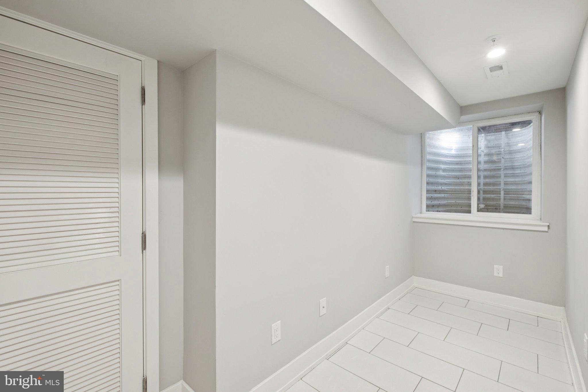1533 South Lambert Street Philadelphia, PA 19146 - Photo 23 of 29 a view of an empty room with a window