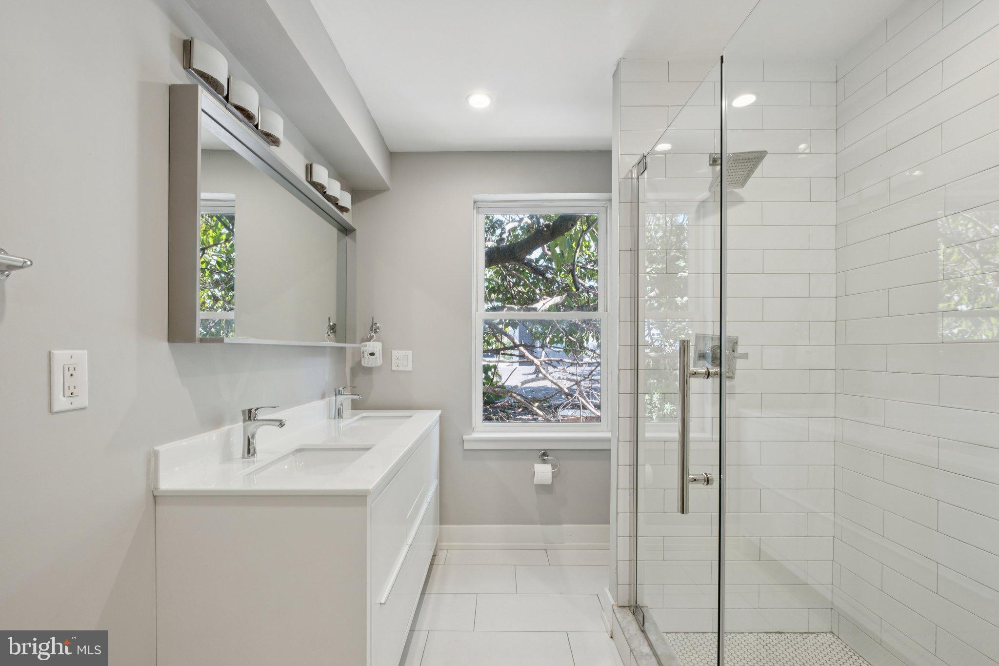 1533 South Lambert Street Philadelphia, PA 19146 - Photo 3 of 29 a bathroom with a sink a toilet and shower