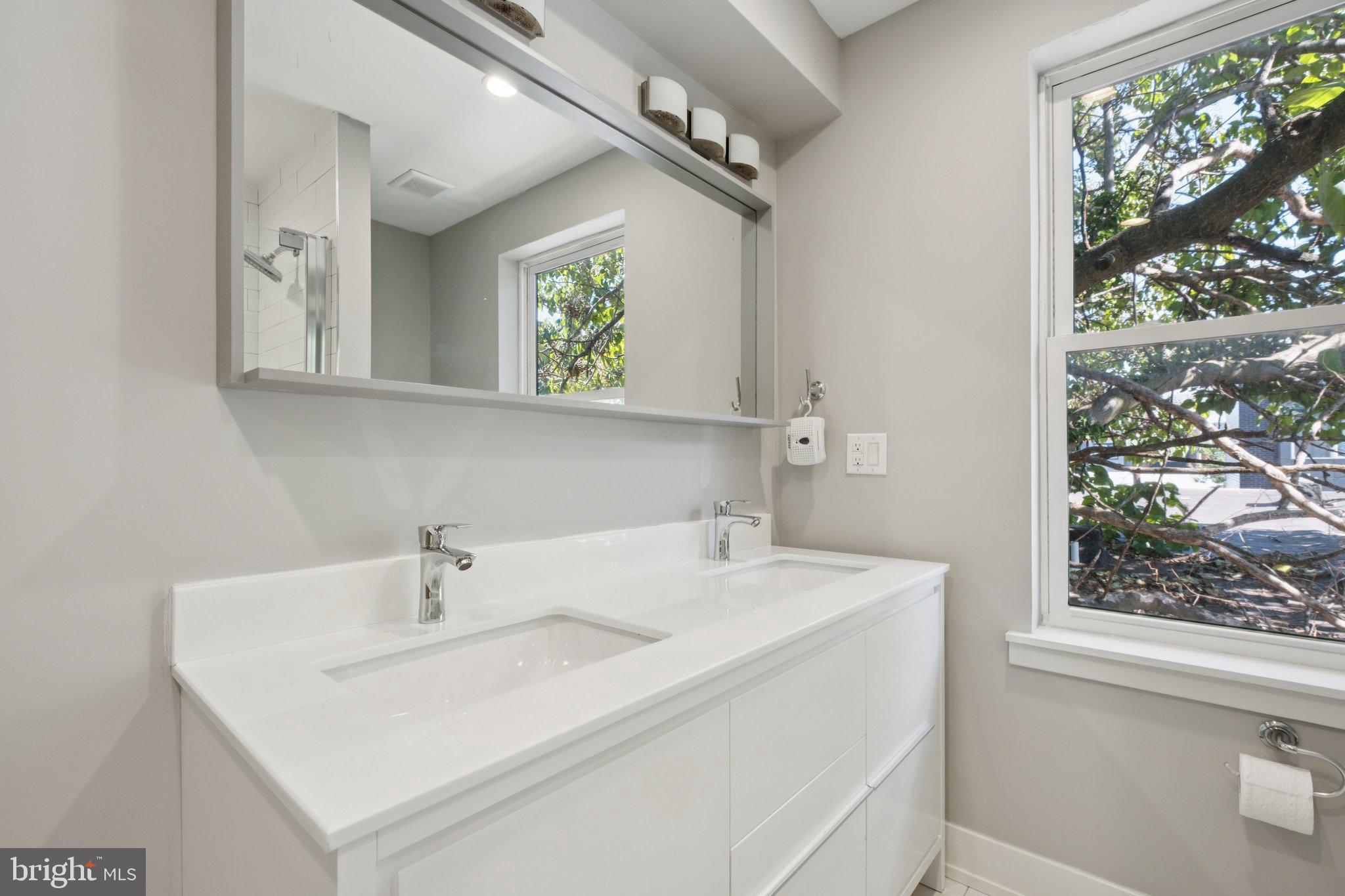 1533 South Lambert Street Philadelphia, PA 19146 - Photo 4 of 29 a bathroom with a sink and a mirror