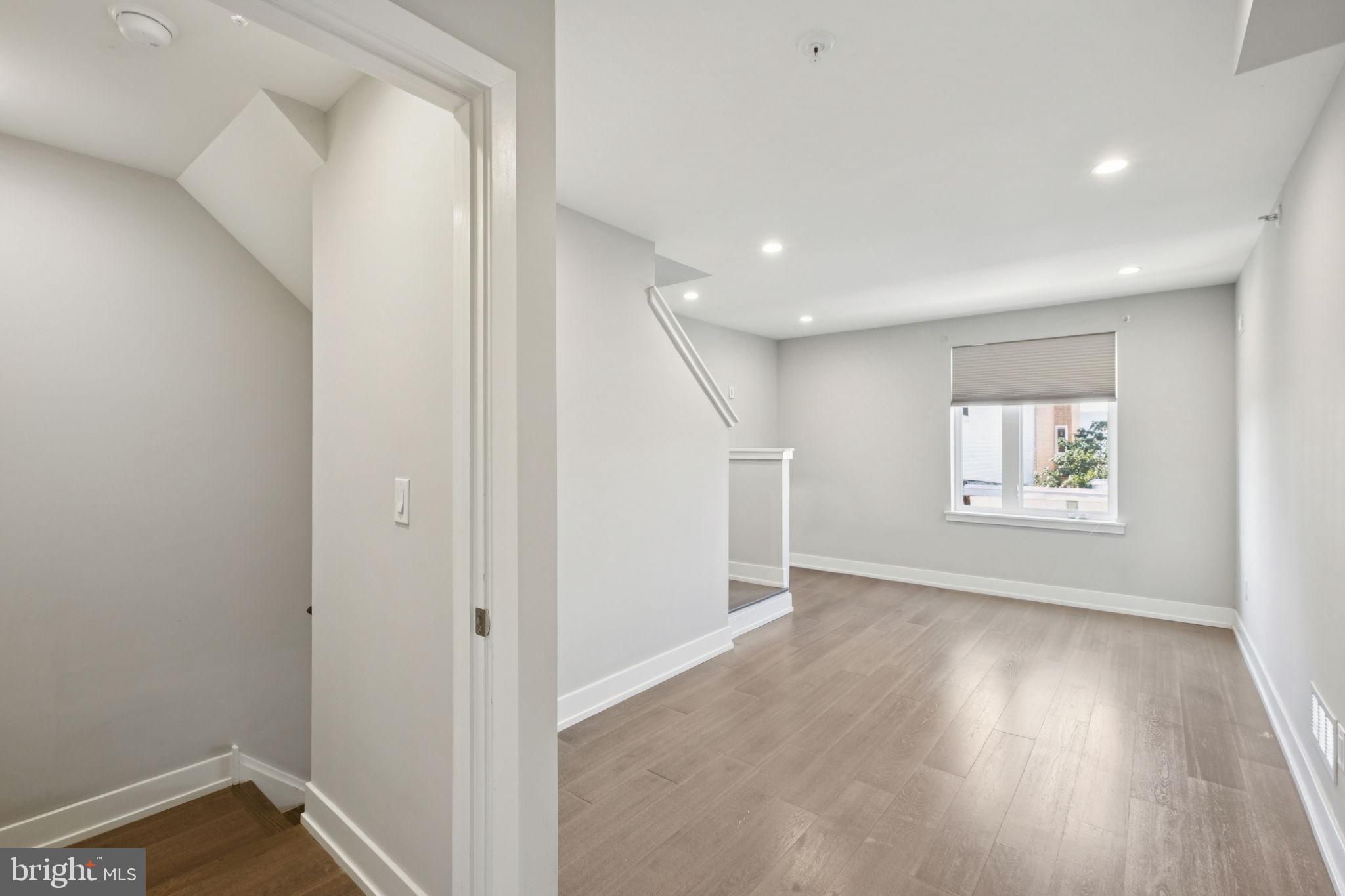 1533 South Lambert Street Philadelphia, PA 19146 - Photo 5 of 29 a view of hallway with window and wooden floor