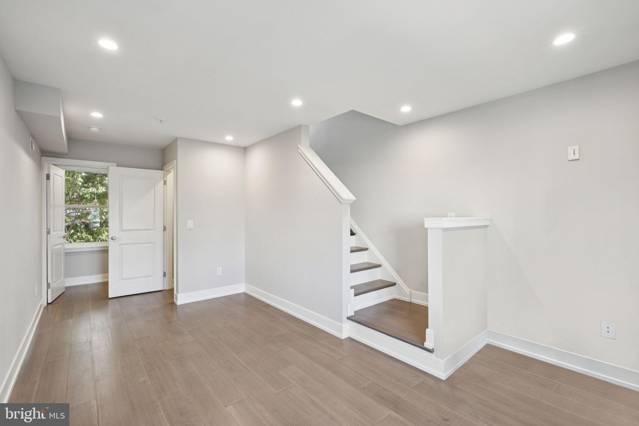 1533 South Lambert Street Philadelphia, PA 19146 - Photo 6 of 29 an empty room with wooden floor and entryway
