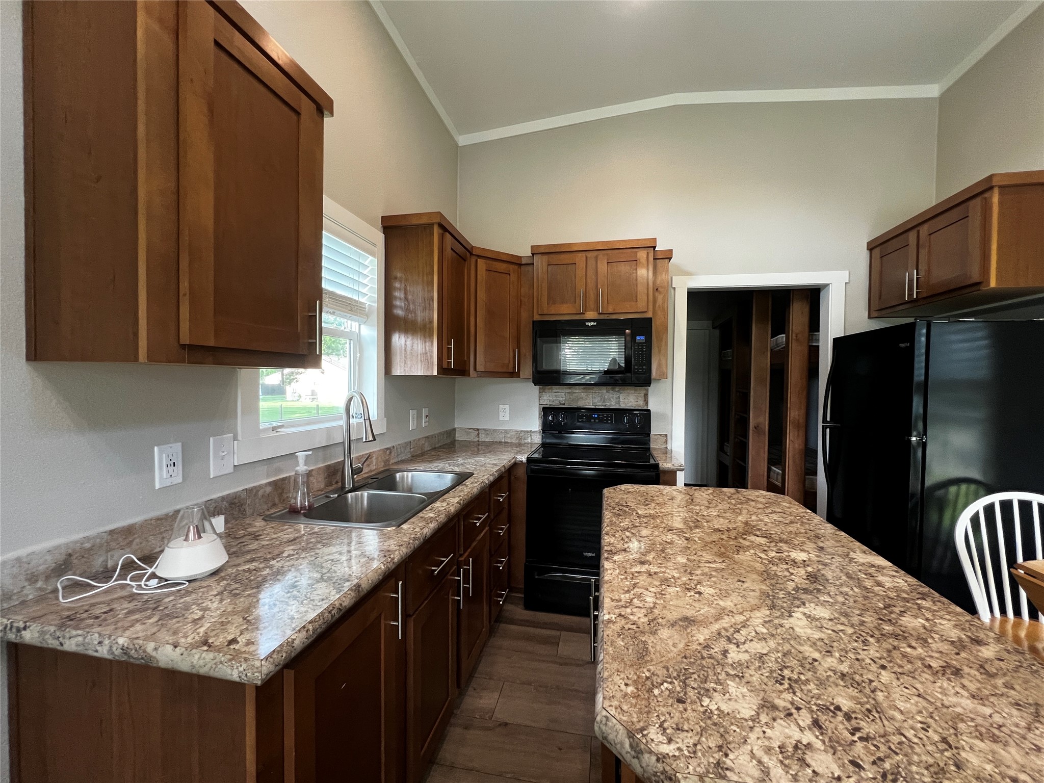 103 Pitts Road, Unit C Richmond, TX 77406 - Photo 3 of 12 a kitchen with stainless steel appliances granite countertop a sink dishwasher stove refrigerator and cabinets