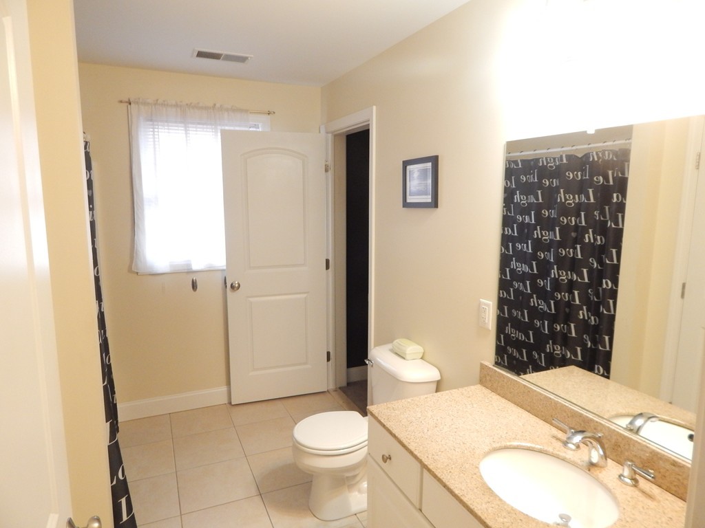 530 Stevens Street Fall River, MA 02721 - Photo 13 of 22 a bathroom with a sink a toilet and shower