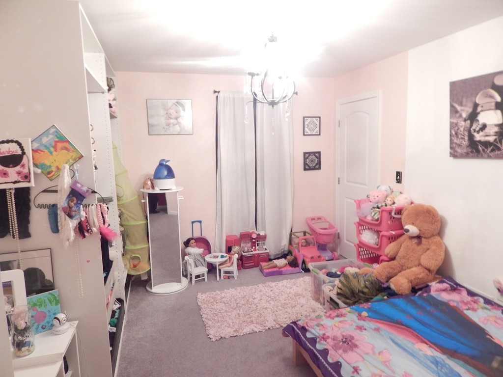 530 Stevens Street Fall River, MA 02721 - Photo 14 of 22 a bedroom with furniture and a bed