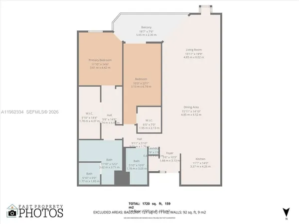 a living room with stainless steel appliances kitchen island granite countertop furniture a rug and a kitchen view