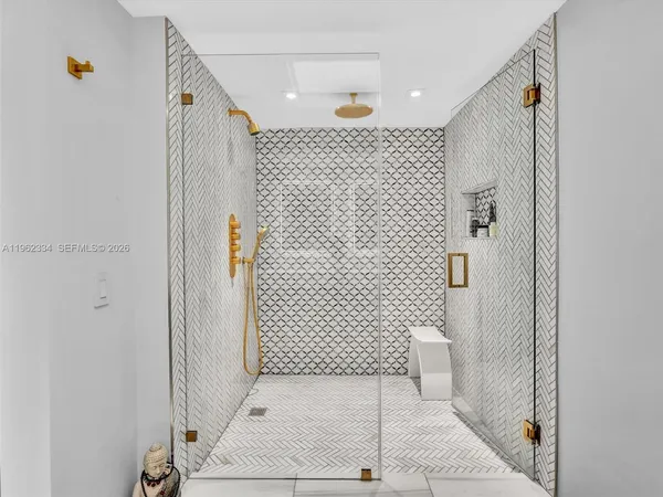 a bathroom with a toilet a sink and shower
