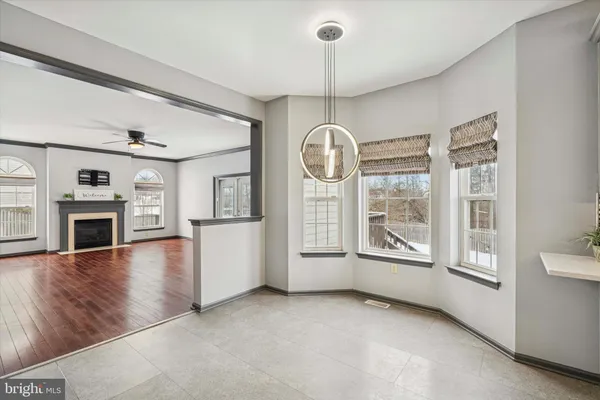 a large white kitchen with a window