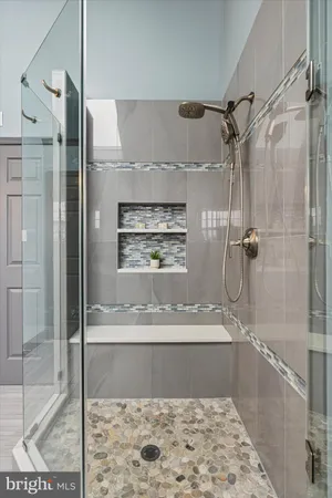 an empty room with a window and ceiling fan