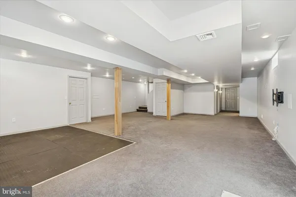 a view of a roof deck with wooden fence