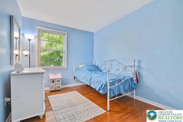 a bed room with a bed and a window