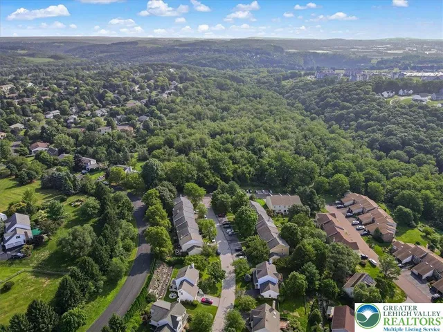 a view of a swimming pool with a garden