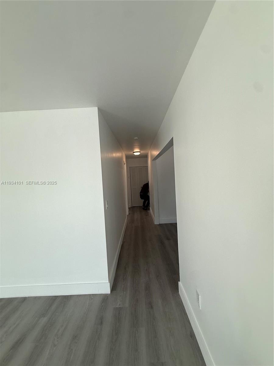 1055 Northwest 34th Avenue, Unit 1055 Miami, FL 33125 - Photo 12 of 19 a view of a hallway